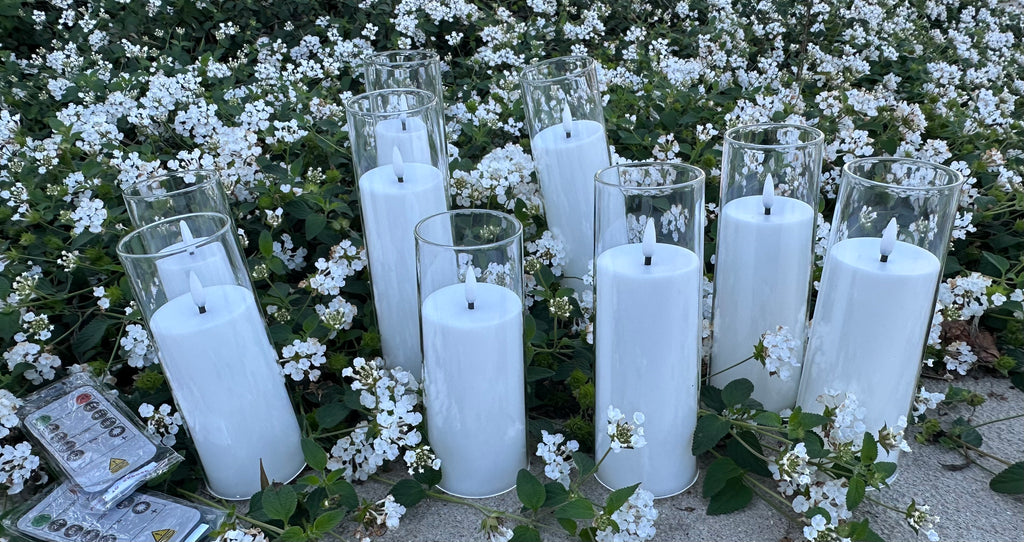 9 - White Flameless Battery-operated candles that last over 300 hours on just one single battery! Requires - AA battery (not included) Comes with 2 remote. Pack of 9 candles. $55