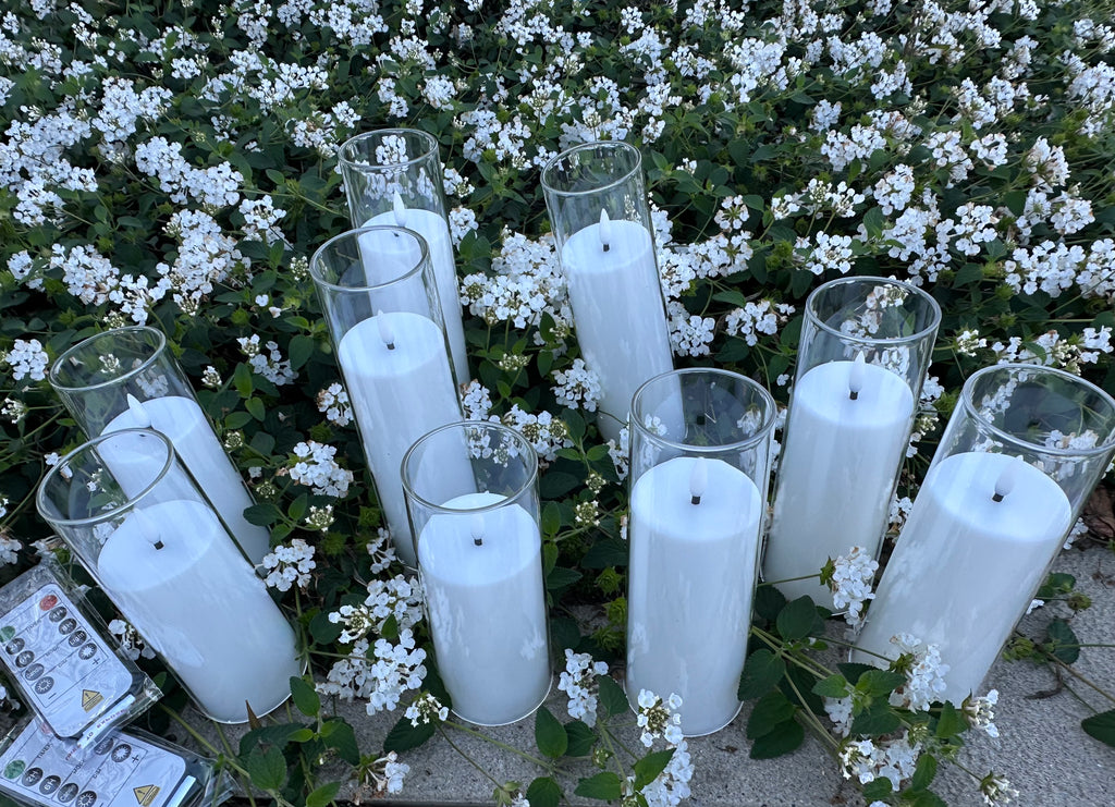 9 - White Flameless Battery-operated candles that last over 300 hours on just one single battery! Requires - AA battery (not included) Comes with 2 remote. Pack of 9 candles. $55