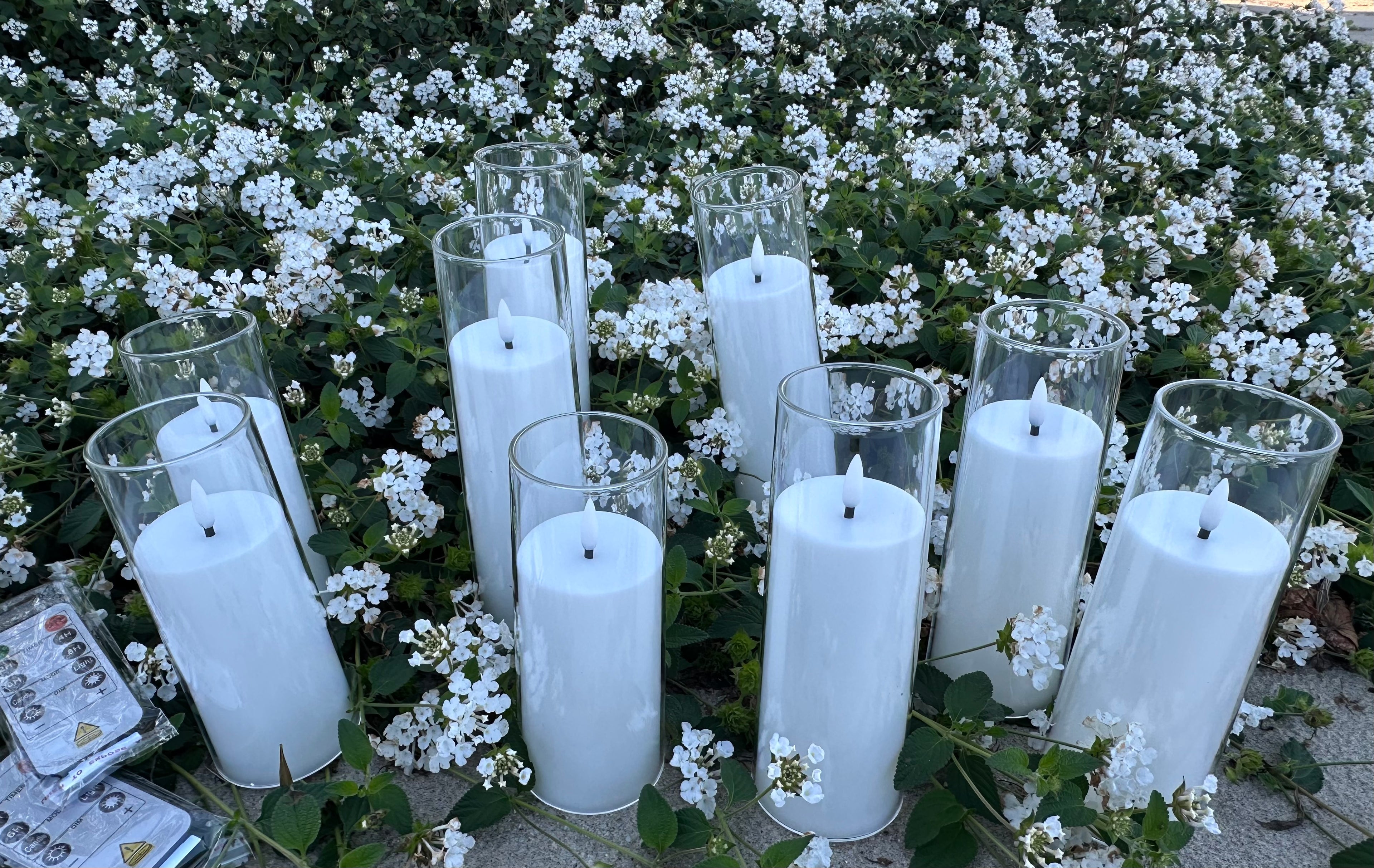 9 - White Flameless Battery-operated candles that last over 300 hours on just one single battery! Requires - AA battery (not included) Comes with 2 remote. Pack of 9 candles. $55